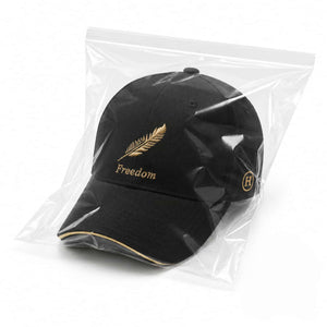 Black embroidered baseball cap packed in transparent OPP bag