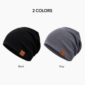 Black and gray slouchy winter beanies on a clean white background