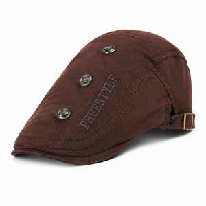 Brown vintage flat cap for men with adjustable back buckle, decorative metal button details, and cotton fabric on a clean white background.
