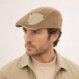 Studio model wearing khaki corduroy flat cap for clean product display