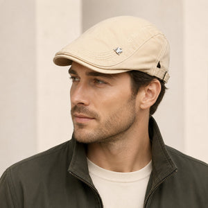 Male model wearing khaki cotton flat cap in clean studio styling
