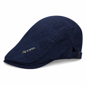 Navy cotton ivy flat cap with adjustable side buckle on white background