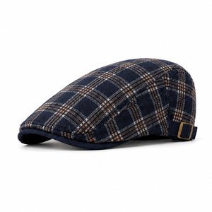 Navy men's plaid flat cap with adjustable back strap, classic ivy silhouette, and clean white background.