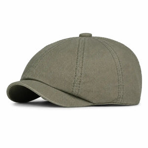 Olive green vintage newsboy cap with curved brim and unisex everyday style