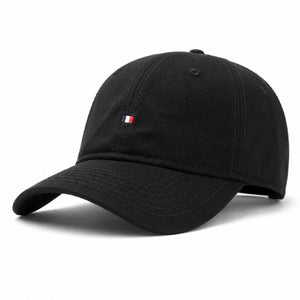 Black cotton sun protection baseball cap with curved brim, soft crown, and adjustable fit.