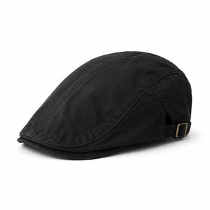 Black men's adjustable flat cap in cotton with a classic ivy silhouette and clean white background.