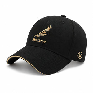 Black men's embroidered baseball cap with gold Sunshine leaf detail, curved brim, and casual everyday style on a clean white background.
