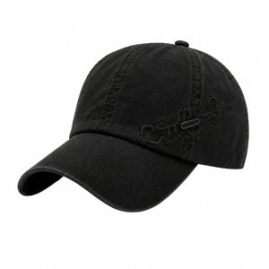 Black men's textured baseball cap with curved brim, side sport detail, and classic casual style on a clean white background.