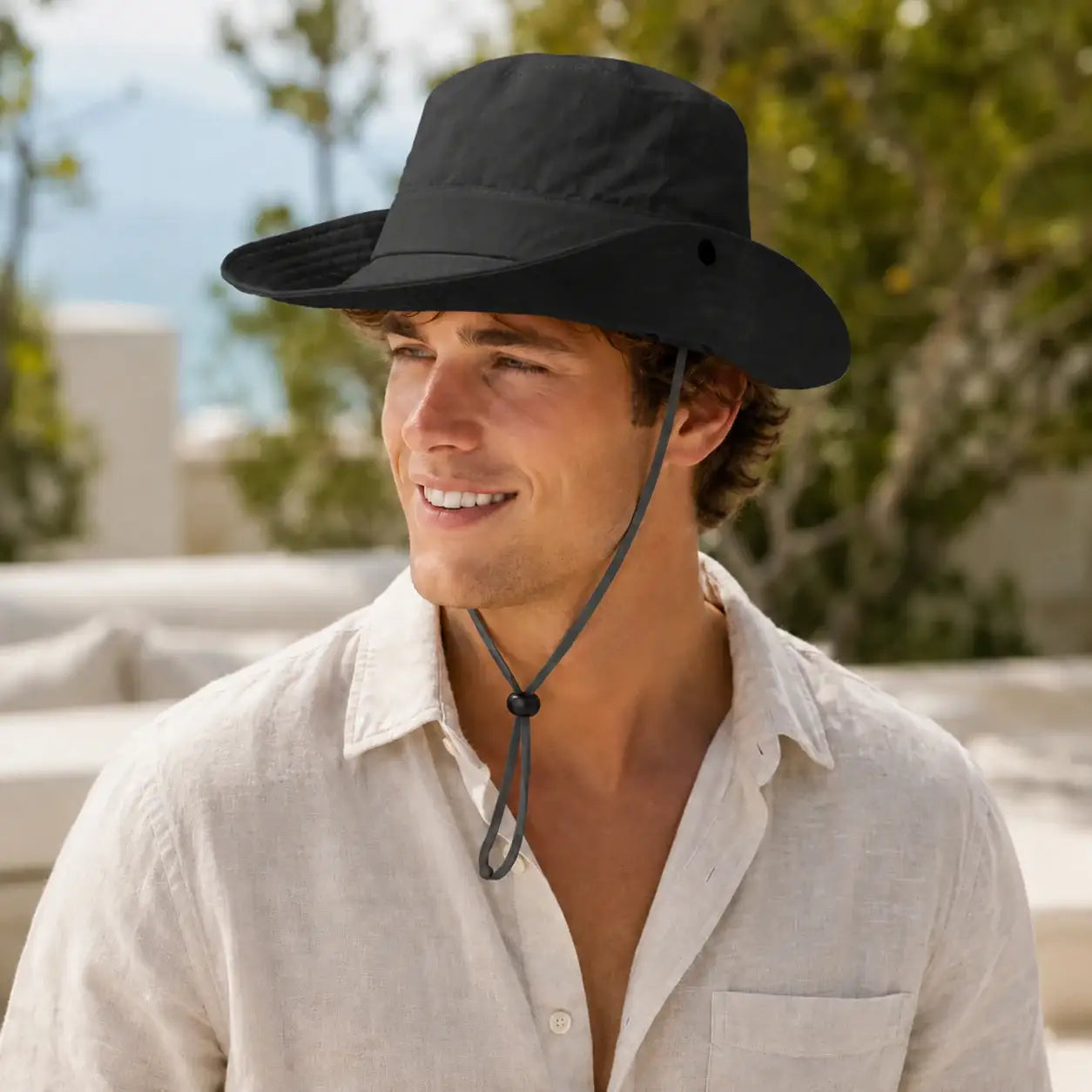 Black outdoor sun hat with wide brim and adjustable chin cord