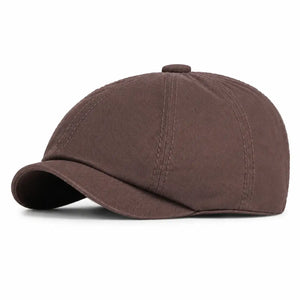 Brown vintage newsboy cap with curved brim and soft cotton fabric