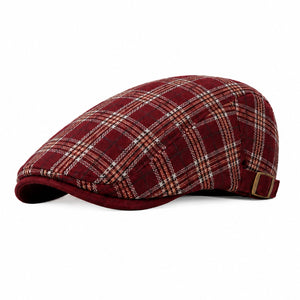 Burgundy men's plaid flat cap with adjustable back strap, classic ivy style, and clean white background.