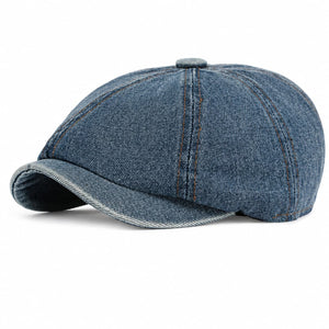 Denim blue washed denim newsboy cap on white background