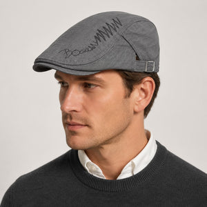 Gray cotton ivy flat cap worn with smart casual menswear