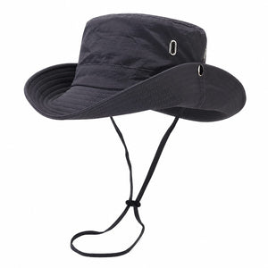Gray outdoor sun protection hiking bucket hat with wide brim, adjustable chin cord, metal eyelets, and lightweight polyester fabric on a clean white background.