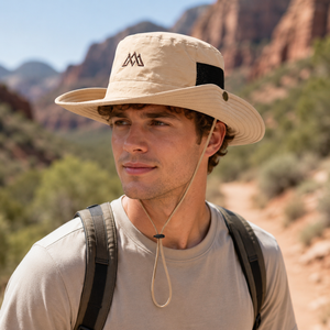 Khaki outdoor sun protection bucket hat with adjustable chin cord, breathable mesh side panel, embroidered front detail, and wide brim coverage