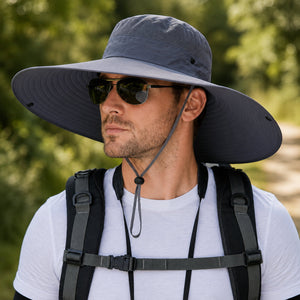 Close-up model image of dark gray wide brim sun hat with chin cord