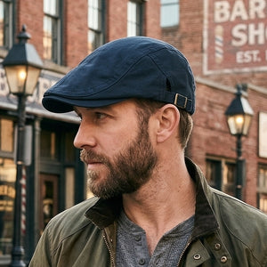 Navy vintage cotton flat cap with adjustable buckle and unisex everyday style