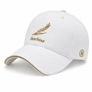 White men's embroidered baseball cap with gold Sunshine leaf detail, curved brim, and clean casual style on a white background.
